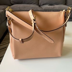 Coach crossbody purse. Coral color. New with tag. Comes with dust bag.